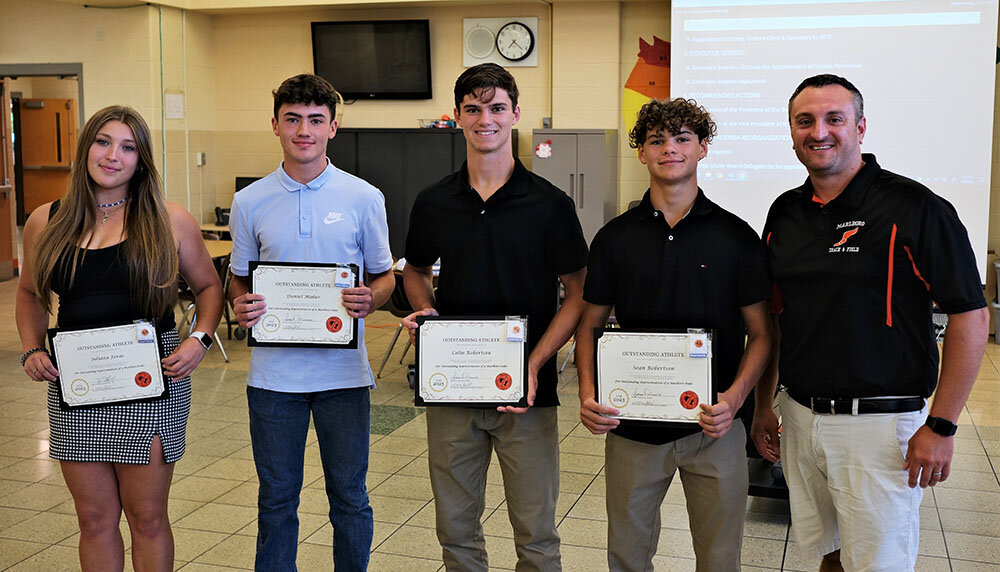 Last week, the Marlboro School District Administration and School Board honored their Outstanding Student Athletes in Track and Field for 2023: Pictured L-R: Juliana Juras a High School Discus Champion and performed in Shotput and the Hammer Throw; Daniel Maher, 4x 100 Meter Relay Team; Colin Robertson, for the 100 and 200 Meter Dash and 4x 100 Meter Relay Team; Sean Robertson, for Pole Vault and 4x 100 Meter Relay Team; and Track & Field Coach Peter Carofano.